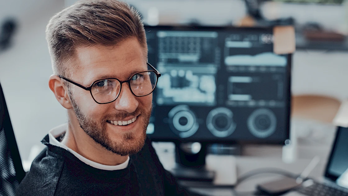 An AI professional smiling