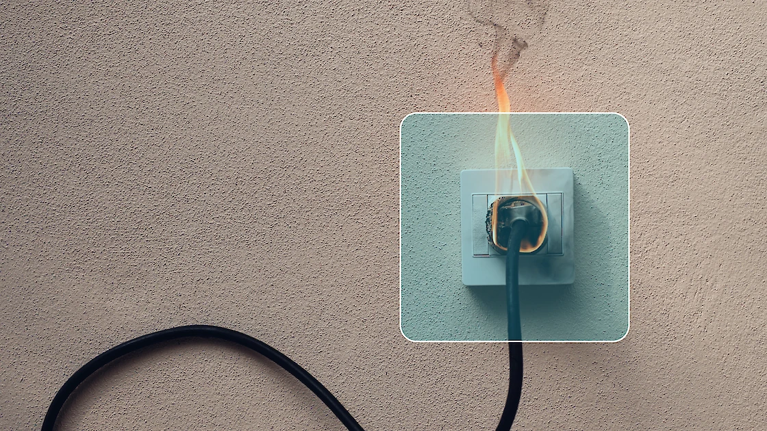 A power outlet at a construction site catching fire.