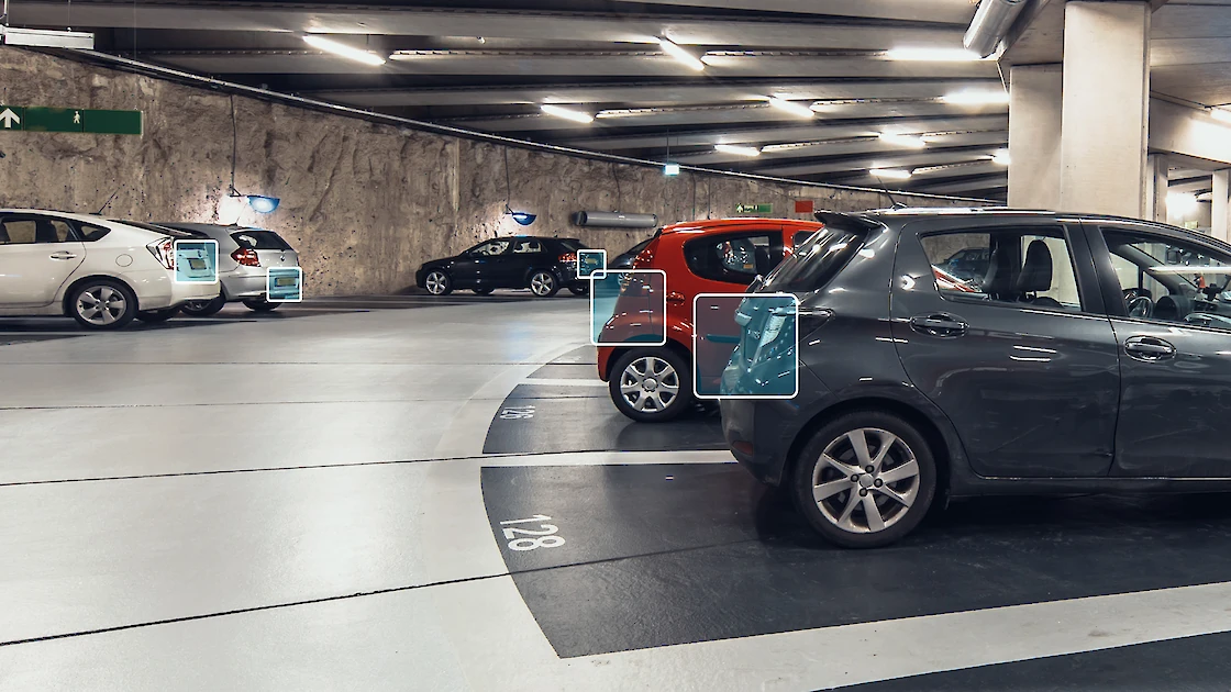 License plates being monitored in a parking garage for security.