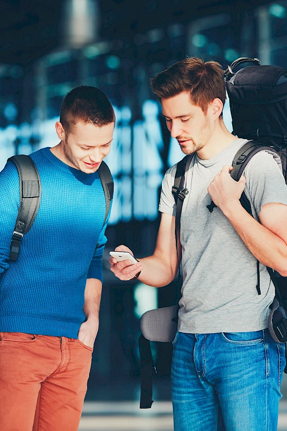 Two travelers accessing their private cloud over the internet.
